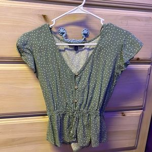 green/white polka dot blouse